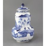 A Chinese blue and white gourd-shaped vase and cover, late 19th century, painted with figures amid