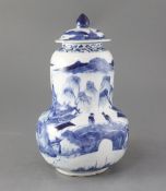 A Chinese blue and white gourd-shaped vase and cover, late 19th century, painted with figures amid