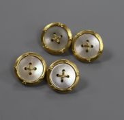 A pair of 18ct gold and mother of pearl dress cufflinks in the form of buttons.