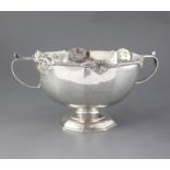 A late Victorian silver two handled punch bowl, by Martin, Hall & Co, with panelled body and pierced
