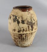 A 19th century, probably French, earthenware storage jar, with unglazed body and a two handled