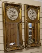 A pair of gilt mirrors with resin plaques W.31cm
