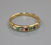 A modern 18ct gold and gem set "Dearest" half hoop ring, size R.