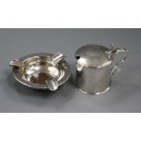 A George III silver mustard, London 1785, maker Robert Hennell and a silver ashtray inset with a