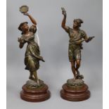 A pair of spelter figural musicians, on wooden bases tallest 44cm