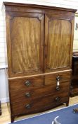 A Regency mahogany linen press fitted three sliding trays W.124cm