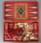 A leather folding chess and draught set and ivory pieces length 38cm