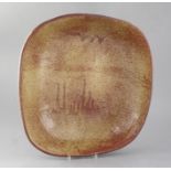Pierre Culot (Belgian 1938-2011). A red/brown-glazed large stoneware dish, 'C' monogram to base,