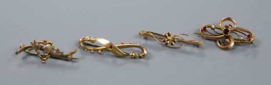 Four assorted early 20th century bar brooches, including three gem set, gross 7.3 grams.