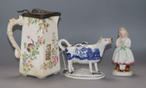 A Staffordshire Willow pattern cow creamer (a.f.), a Staffordshire figure and a jug tallest 22cm