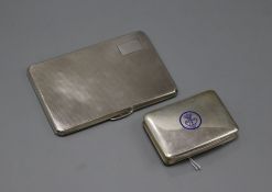 An engine-turned silver cigarette case and a small Continental cigarette case with blue enamel