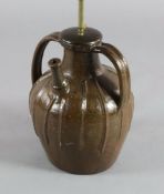 A French medieval brown spouted jar, with two lug handles, 13.5in.