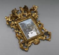 A small Victorian Florentine carved giltwood framed mirror length 31cm