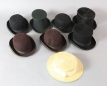 Various operas: A collapsible top hat, two other top hats, four bowler hats and a straw boater