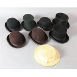 Various operas: A collapsible top hat, two other top hats, four bowler hats and a straw boater