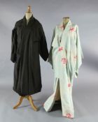 Madame Butterfly: A rail of eleven short multi-coloured woven and printed kimono jackets and