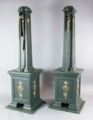 Four large bottle green and gilt painted square based lighting pillars specially made to mount