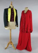 Tosca: A rail of yellow and maroon jackets, a red evening dress and jacket, white cotton