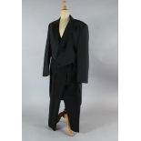 A collection of twenty one black tail coats and twenty one trousers, in mixed sizes