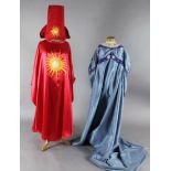 The Magic Flute: Two brightly coloured satin appliqué cloaks, a blue appliqué dress, two leather