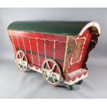 Elisir L'Amore: Dr Dulcamara's stage prop carriage from which his assistant pops out, together