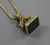 A 19th century yellow metal overlaid bloodstone fob seal, on a yellow metal box link chain, seal