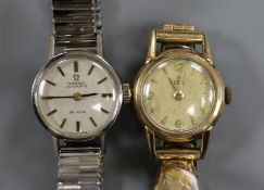 A lady's stainless steel Omega automatic De Ville wrist watch and a lady's Ebel wrist watch, with