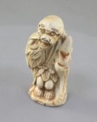 A Japanese porcelain netsuke a Sennin, 19th century, unsigned, 5.3cmProvenance: purchased from