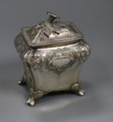 An early Victorian embossed silver bombe shaped tea caddy, Edward Barton, London, 1838, 14cm, 11