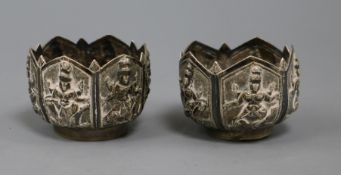 A pair of Indian? repousse white metal salts, 40mm.