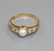 An 18ct gold, single stone cultured pearl and four stone diamond ring, size P/Q.