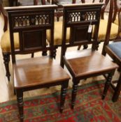 A pair of Victorian mahogany hall chairs