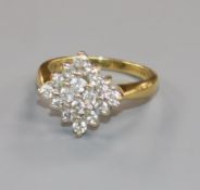 A modern 18ct gold and diamond cluster ring, of diamond shape, size M.