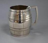 A sterling silver barrel shaped mug, maker C & K, 10.3cm, 7.5 oz.