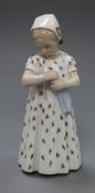 A Bing and Grondahl figure of a girl holding a baby height 19cm