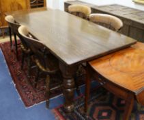 An oak kitchen table and four beech chairs W.152cm