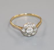 An 18ct gold and diamond cluster ring, size Q.