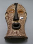 A Songye carved wood mask length 37cm