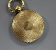 A William IV engine turned yellow metal mourning pendant locket, with internal engraved inscription,