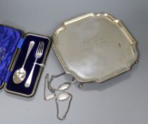 A shaped square silver presentation salver, a cased two-piece Christening set, two silver identity