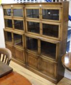 Two Globe Wernicke type oak sectional bookcases W.89cm