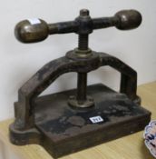 A cast iron book press