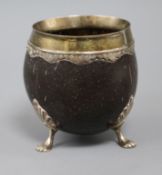 A late 19th/early 20th century white metal mounted coconut cup, 10.3cm.