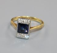 An 18ct gold and platinum, synthetic sapphire and diamond tablet ring, size P/Q.