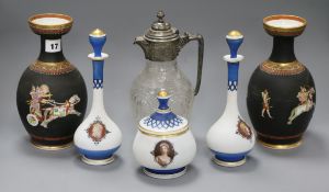 A pair of Staffordshire pottery vases, an opaque glass set of dressing table bottles and a claret