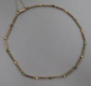 An early 20th century 9ct gold, turquoise? and split pearl set necklet, 38cm.