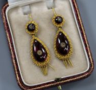 A pair of late Victorian etruscan style yellow metal, cabochon garnet and diamond set pear shaped