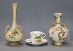 A Royal Worcester blush ivory vase, an ivory ground vase, and a Worcester China Decorator's bird