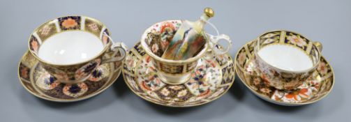 A Royal Worcester scent flask and three Royal Crown Derby Imari duos, the flask of shield form,