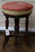 A Victorian revolving piano stool W.34cm